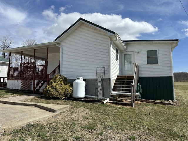 view of home's exterior with a lawn