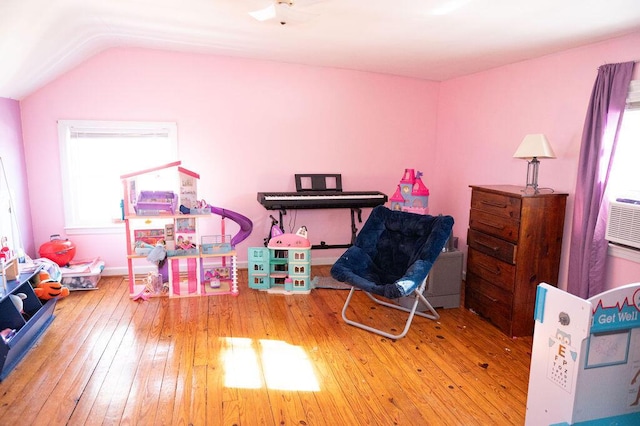 rec room featuring vaulted ceiling and hardwood / wood-style flooring