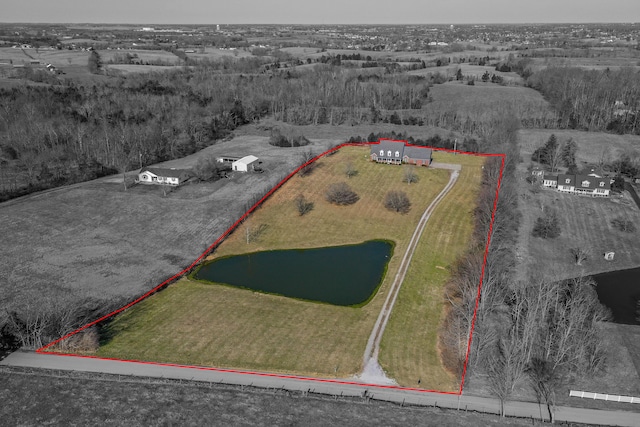 birds eye view of property with a water view and a rural view