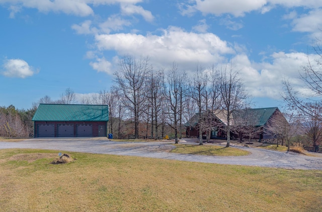 view of yard with an outbuilding and a detached garage