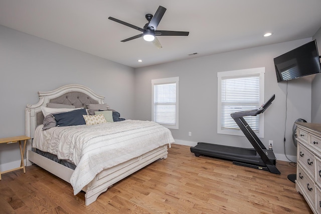 bedroom featuring recessed lighting, visible vents, light wood-style flooring, and baseboards