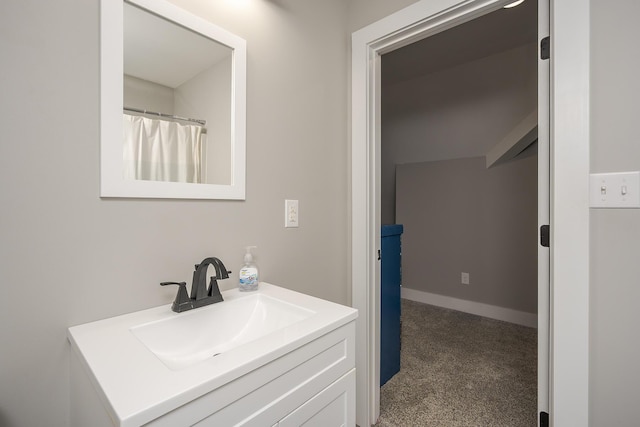 bathroom with vanity and baseboards