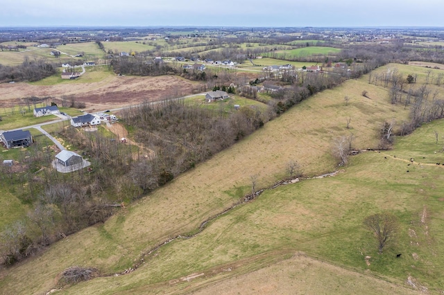 birds eye view of property with a rural view