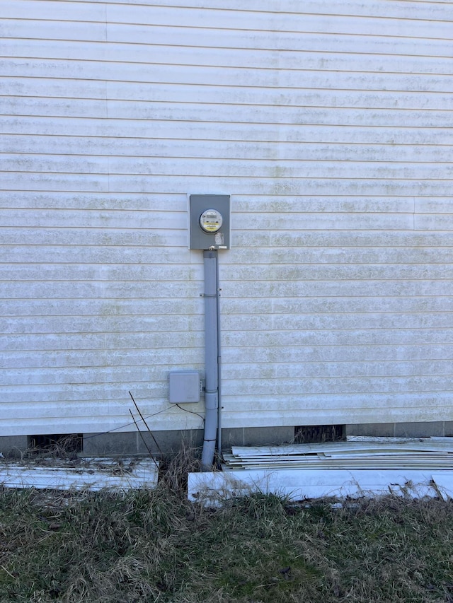 details with electric meter and crawl space