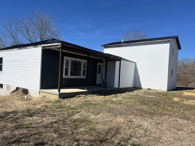 back of property featuring crawl space