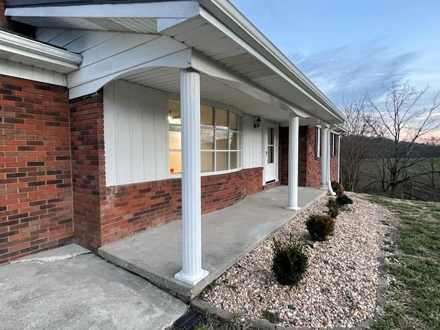 exterior space featuring brick siding