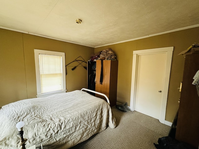 carpeted bedroom with a textured ceiling and crown molding