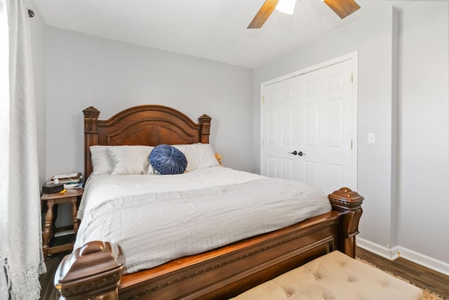 bedroom featuring a ceiling fan, wood finished floors, and baseboards