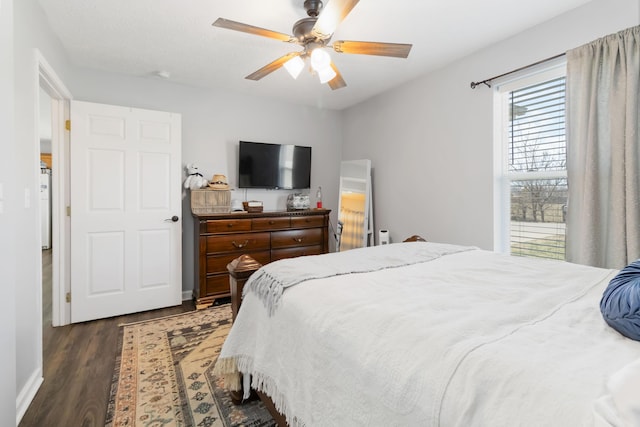 bedroom featuring a ceiling fan and dark wood-style floors