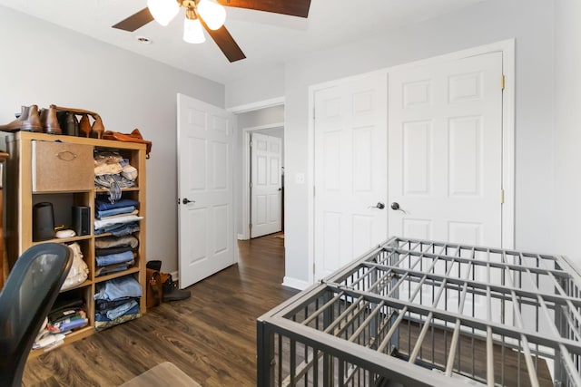 bedroom featuring a closet, a ceiling fan, baseboards, and wood finished floors