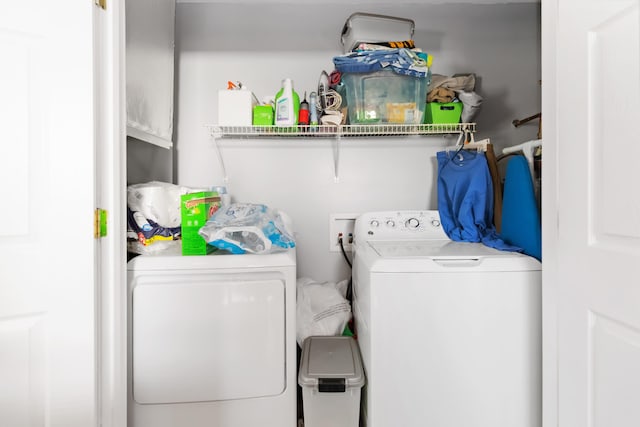 laundry room featuring washer and dryer and laundry area