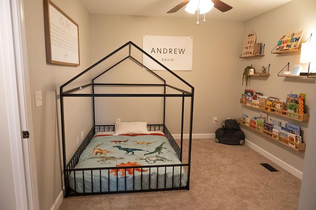 bedroom featuring ceiling fan, carpet, visible vents, and baseboards