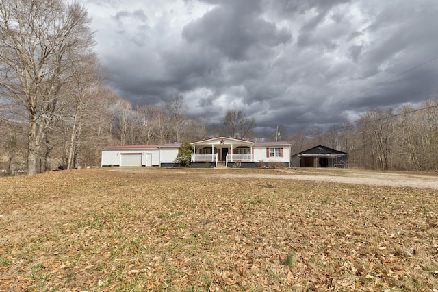 view of front facade with a porch and a front yard