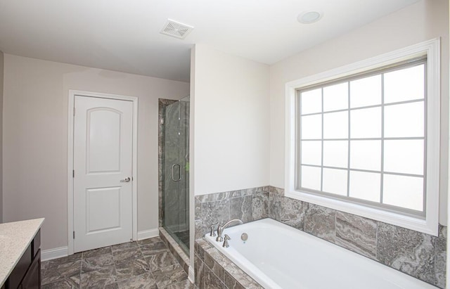 111 Mcintosh Park, Georgetown, KY 40324 - bathroom with visible vents, a garden tub, a stall shower, baseboards, and vanity
