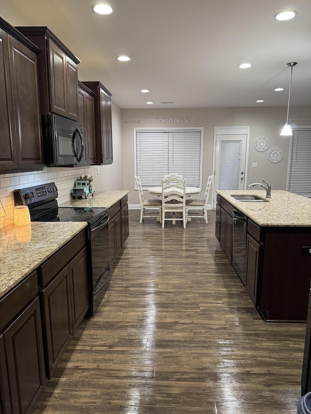 kitchen featuring black appliances, a sink, tasteful backsplash, dark wood-style floors, and recessed lighting