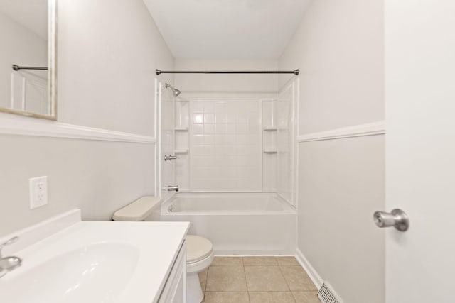 bathroom with vanity, shower / bath combination, tile patterned flooring, and toilet