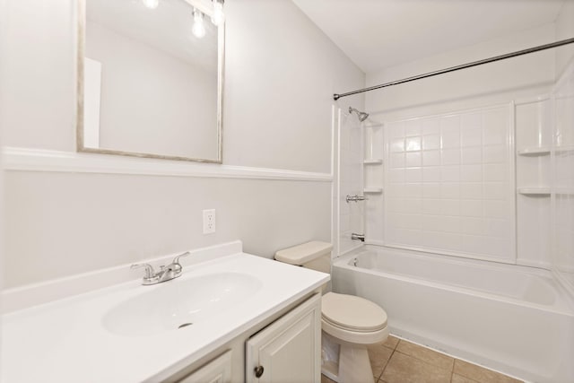 bathroom featuring  shower combination, tile patterned flooring, vanity, and toilet