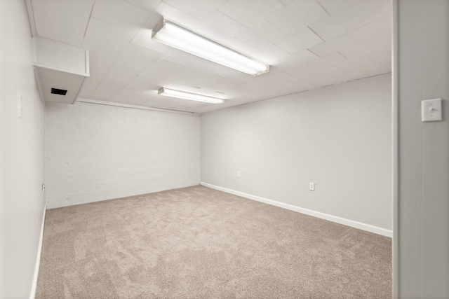 unfurnished room featuring carpet