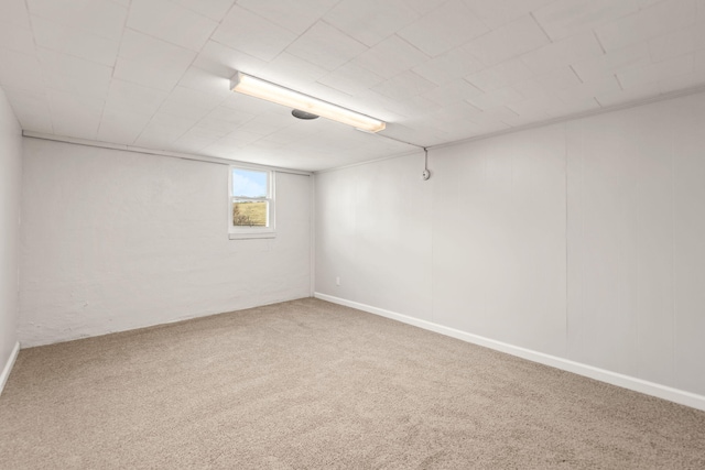 below grade area featuring carpet flooring