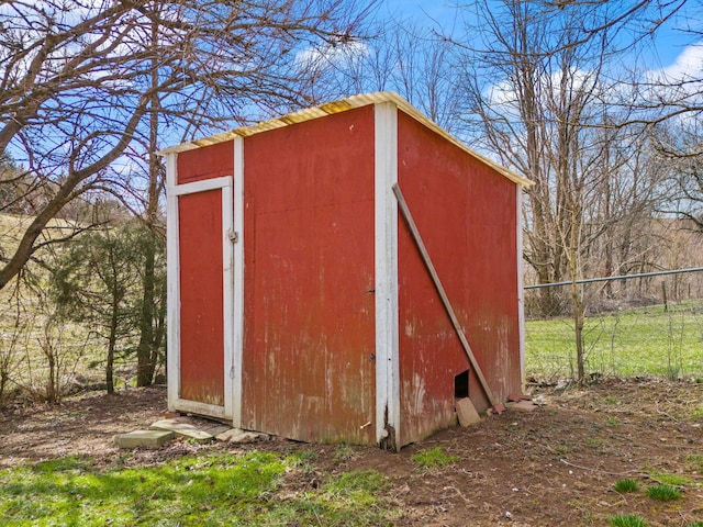 view of shed with fence