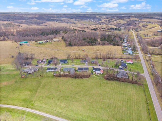 birds eye view of property with a rural view