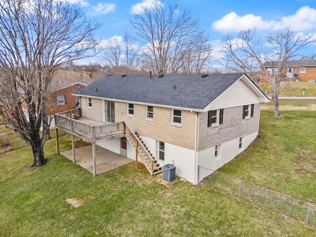 back of property featuring a deck, a patio, central AC unit, a yard, and stairway