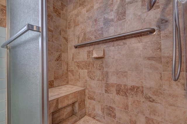 full bath with a shower stall