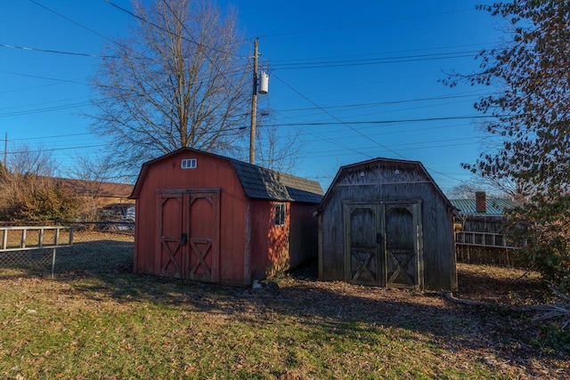 view of shed with fence