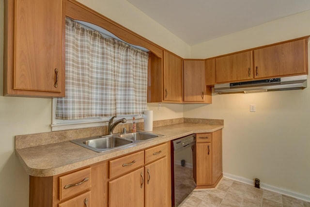 kitchen featuring light countertops, a sink, dishwasher, under cabinet range hood, and baseboards