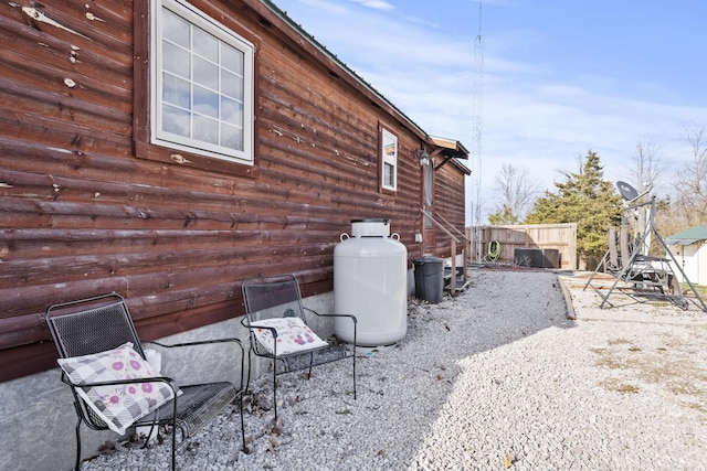 view of home's exterior featuring fence