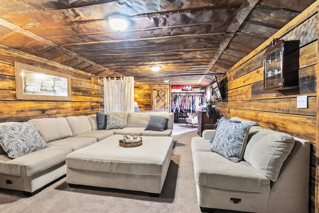 living room with lofted ceiling, carpet, and wooden walls