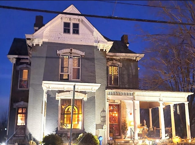 view of front of property featuring brick siding