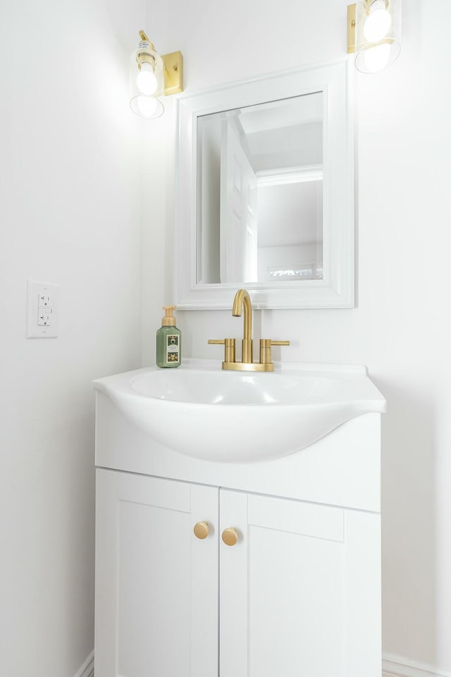 bathroom featuring vanity and baseboards