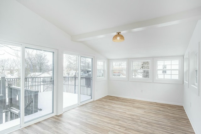 unfurnished sunroom with vaulted ceiling with beams