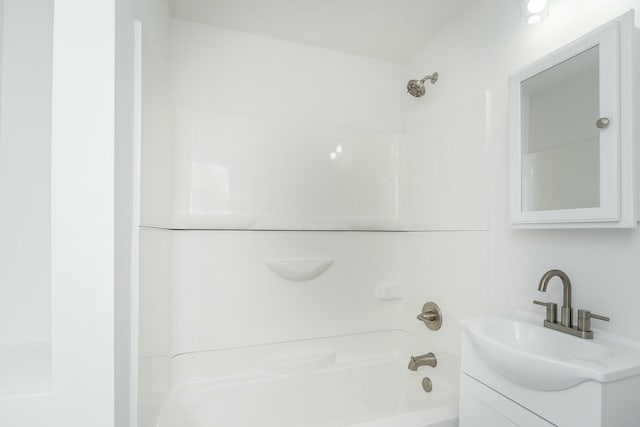 bathroom featuring tub / shower combination and vanity