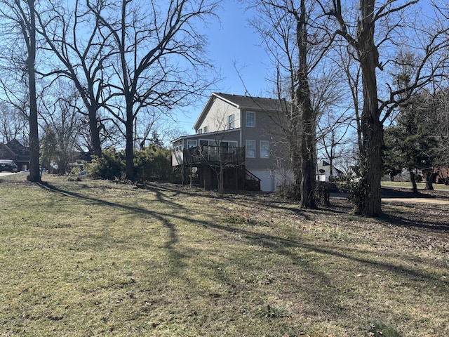 view of yard featuring a wooden deck and stairs