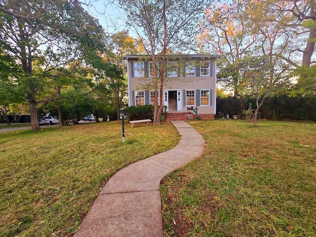 colonial-style house with a front yard