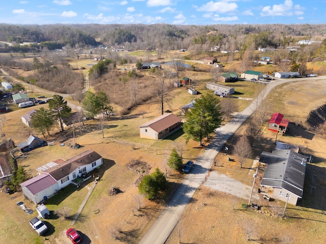 birds eye view of property with a rural view