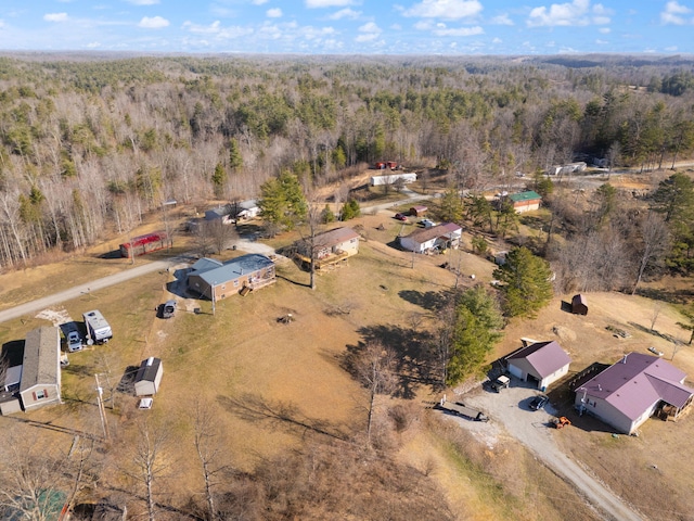 drone / aerial view with a view of trees