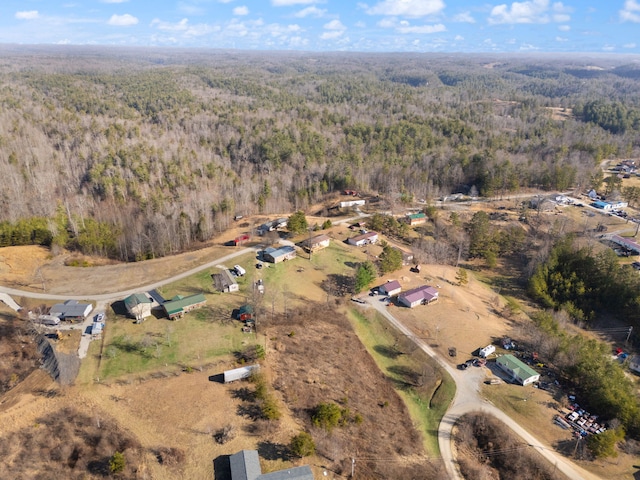 aerial view featuring a wooded view