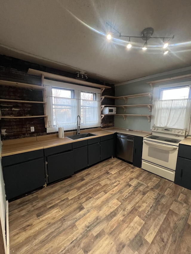 kitchen featuring white electric stove, open shelves, a sink, wood finished floors, and dishwasher