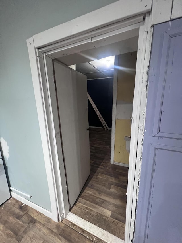 hallway with wood finished floors