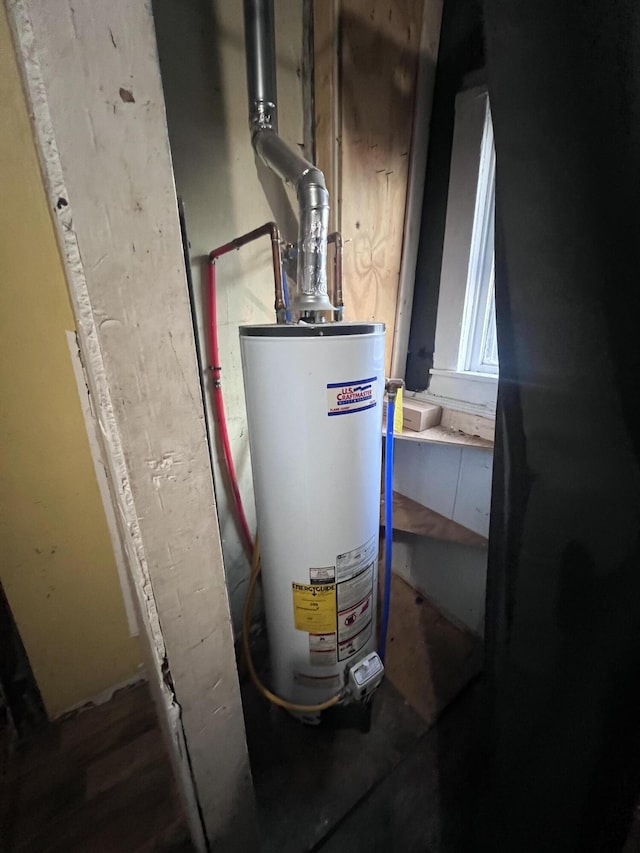 utility room with water heater