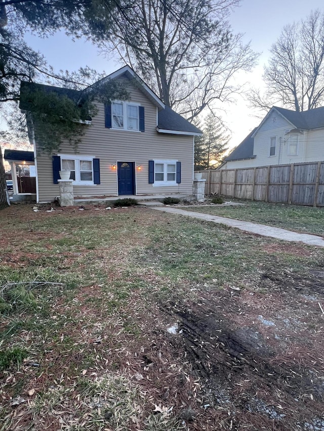 back of property featuring fence