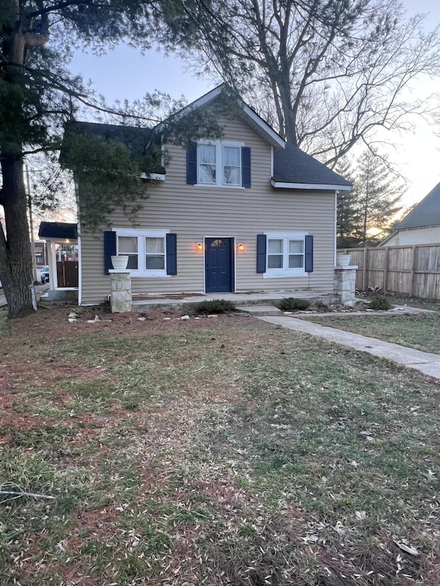 view of front of home with fence