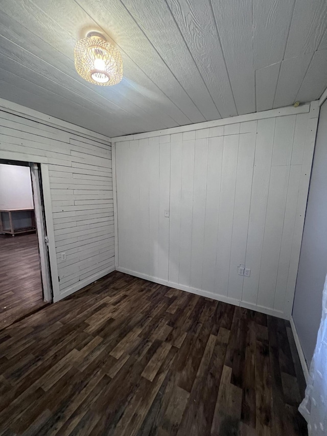 interior space featuring dark wood finished floors and baseboards