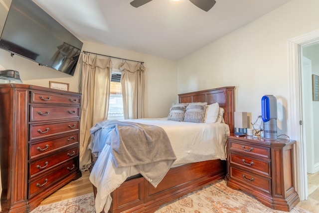 bedroom featuring a ceiling fan and light wood-style flooring