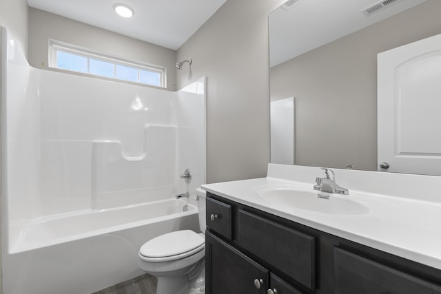 full bathroom with toilet, vanity, visible vents, and shower / bathing tub combination