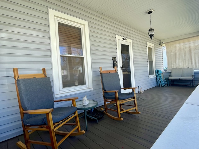 wooden terrace featuring covered porch