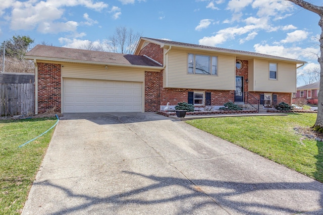 split foyer home with brick siding, a garage, driveway, and a front yard